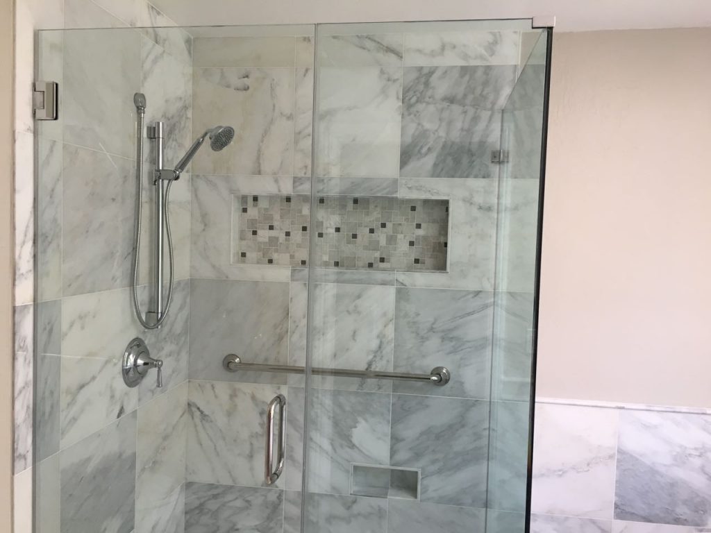 New shower, with glass walls and stonework.