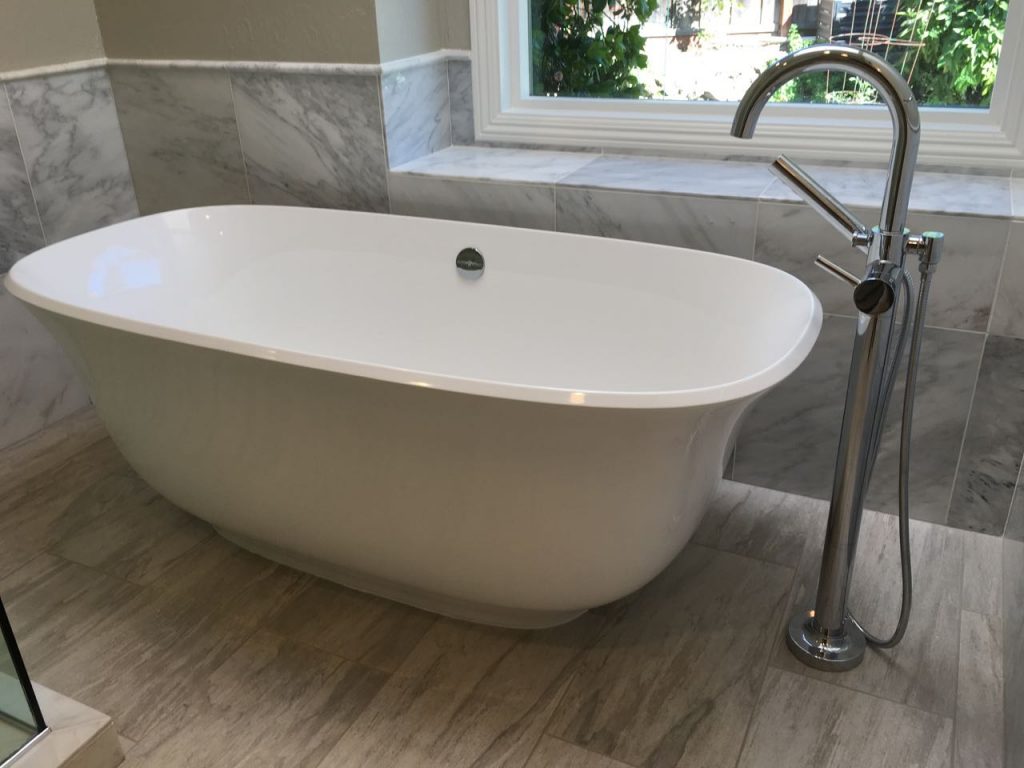 New free-standing tub and tub filler.