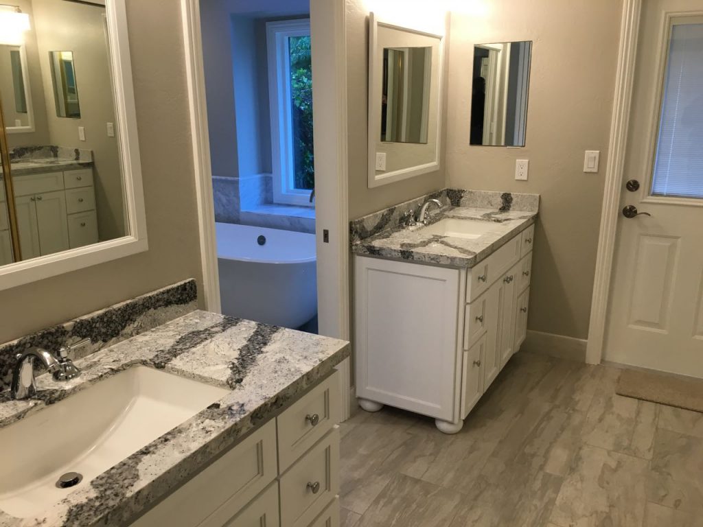 New vanity area, with stonework continuing into shower area.