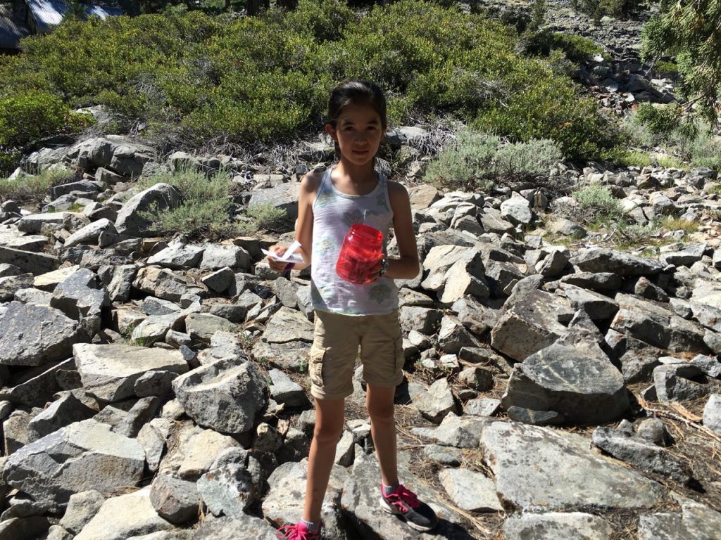 Rachelle finds a geocache.