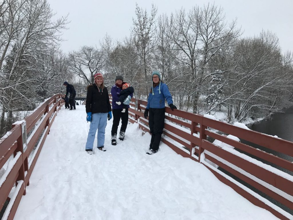 On the footbridge over the river.
